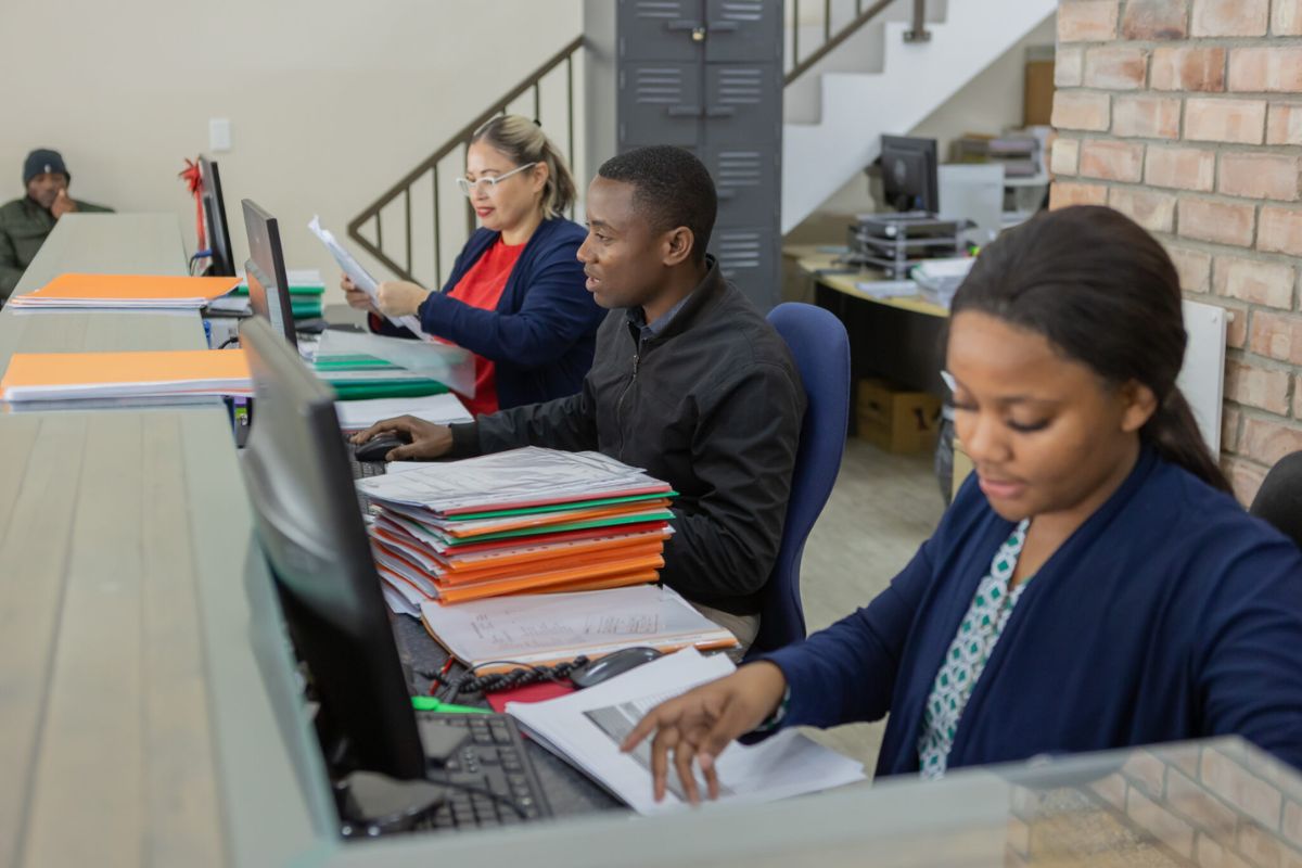 People working at a desk.