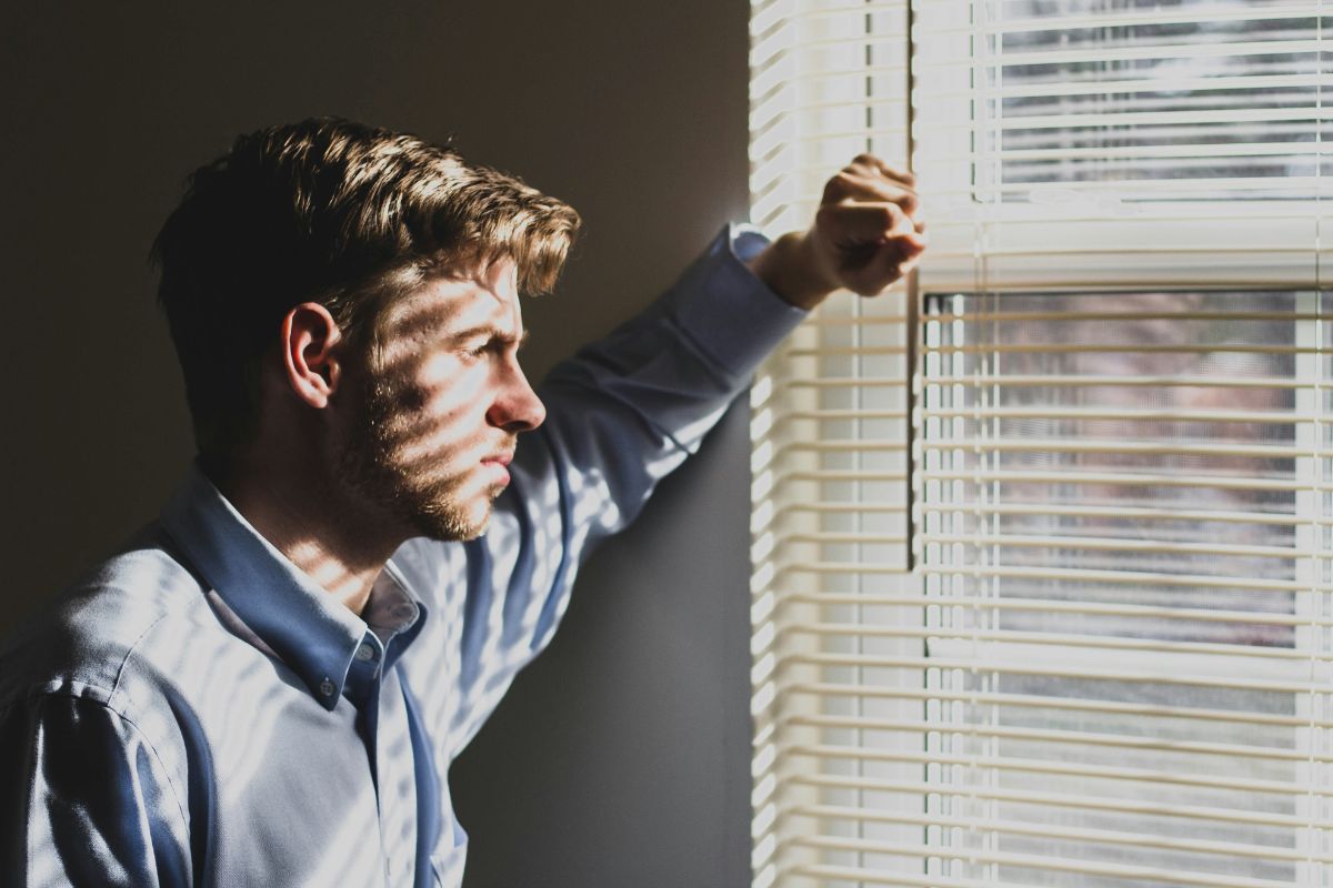 Man looking out of a window.